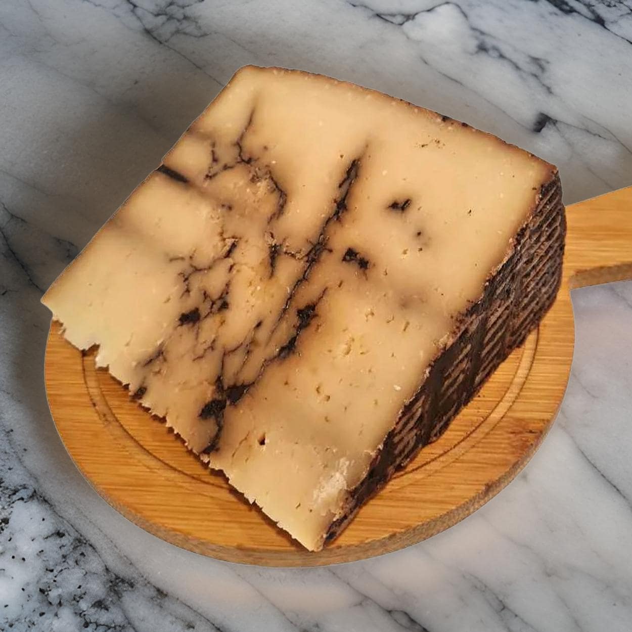 a wedge of black garlic cheese