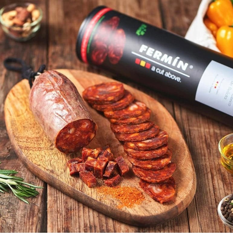 sliced Chorizo Iberico Bellota Fermin on a wooden board