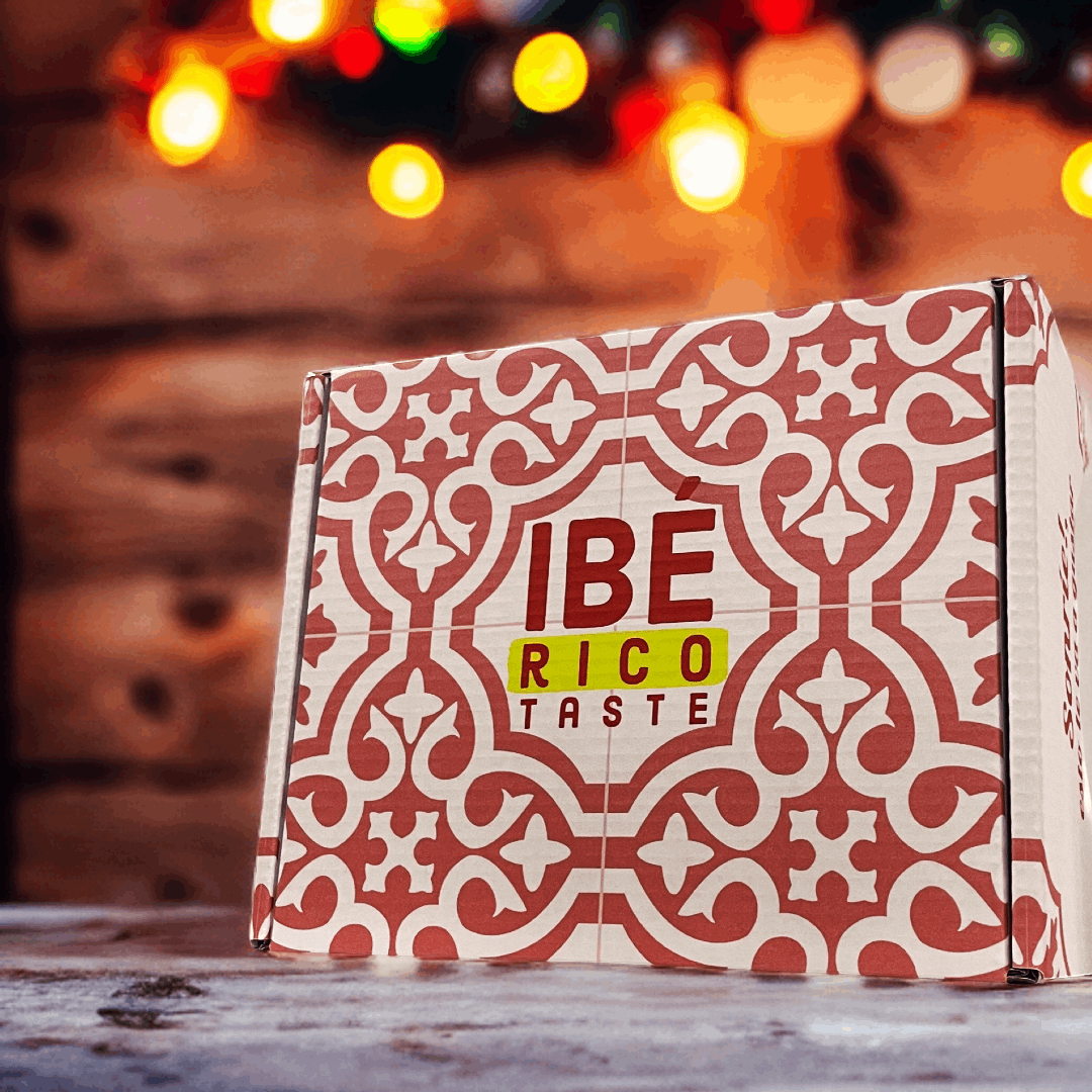 a box with red decorations and Iberico Taste logo