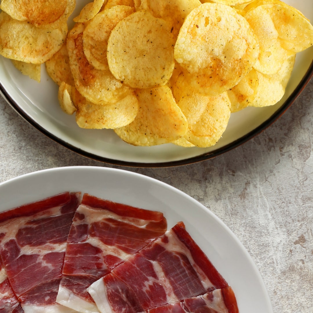 potato chips with sliced jamon iberico