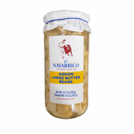 a glass jar with a white label with beans inside